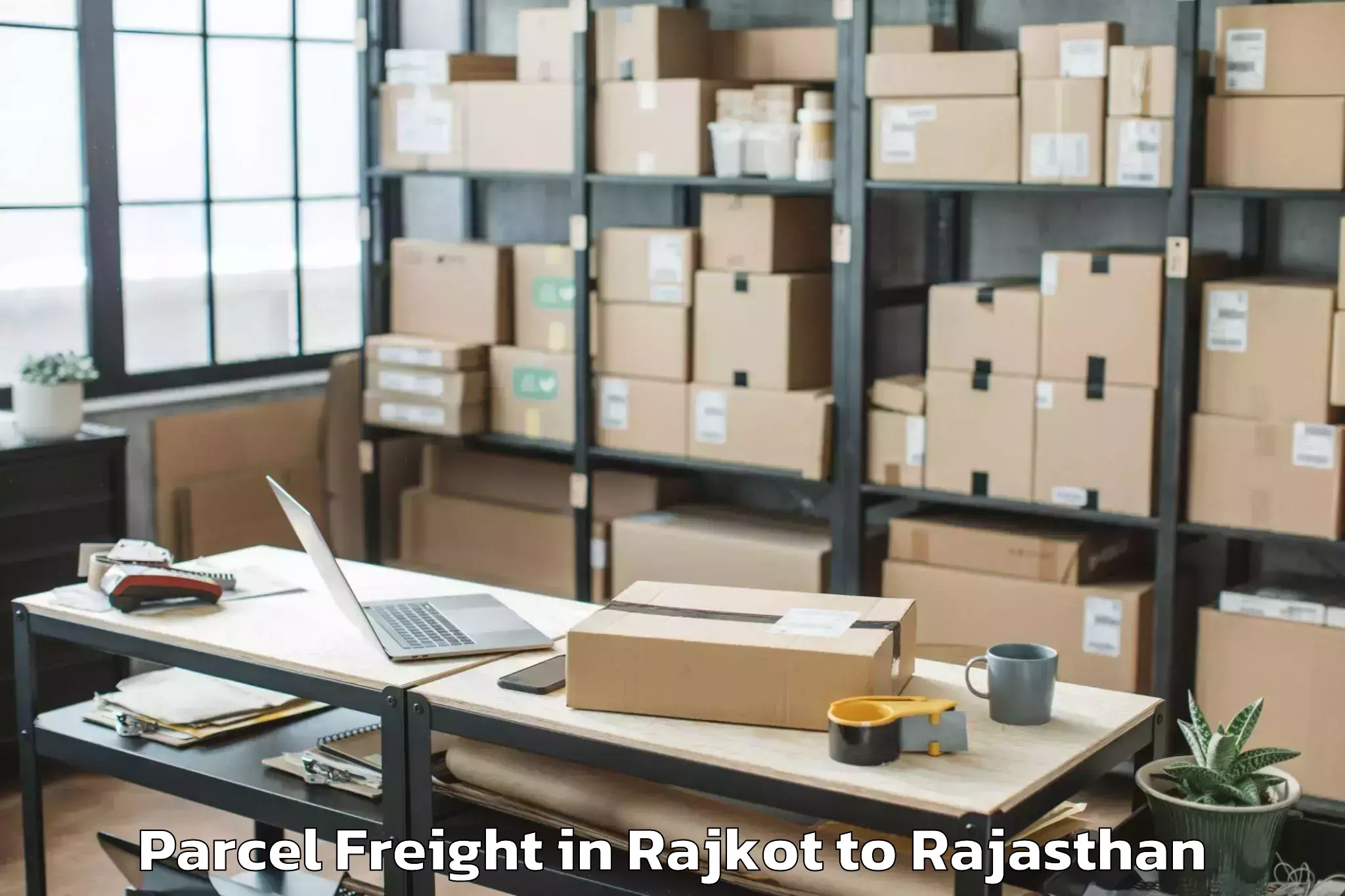 Easy Rajkot to Sagwara Parcel Freight Booking